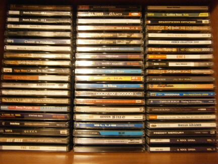 Коллекцию сд-дисков (рок диско ретро поп др.)
